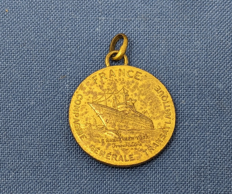 FRANCE: 1962 - Gold-wash maiden voyage medallion as charm