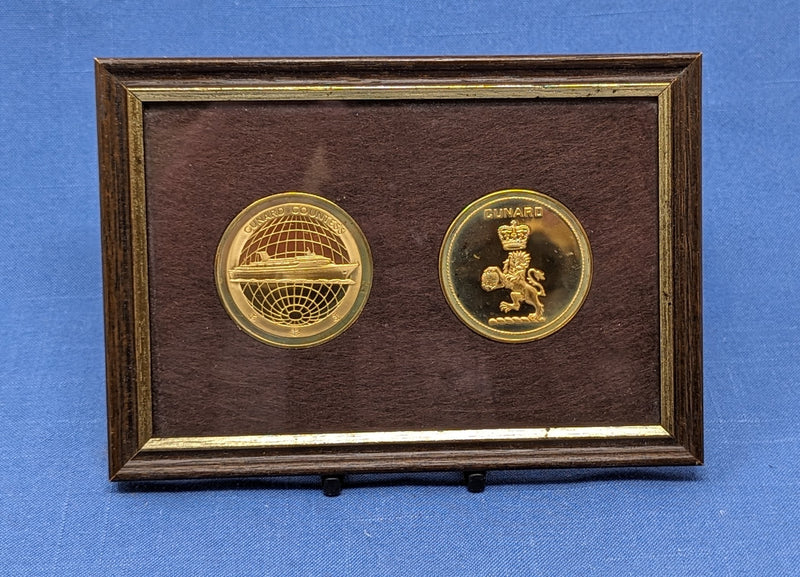 CUNARD COUNTESS: 1976 - Twin framed gold-wash medallions w/ portrait & logo