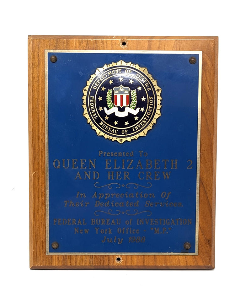 QE2: 1969 - FBI plaque presented to the QE2