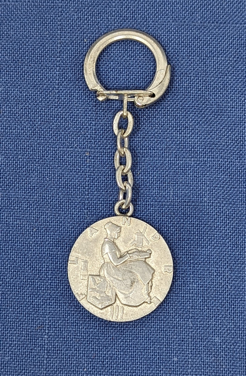 FLANDRE: 1952 - Souvenir key chain w/ maiden voyage medallion